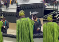 Proud Nigerian dad sprays money on his son at his graduation abroad (Watch)